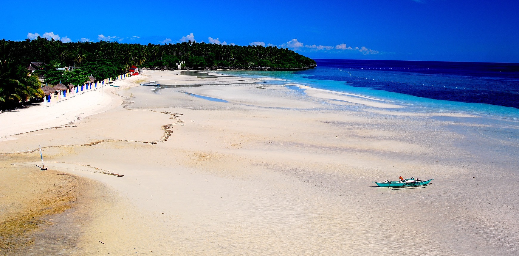 White sandy beach with crystal clear water in Cebu, Philippines
